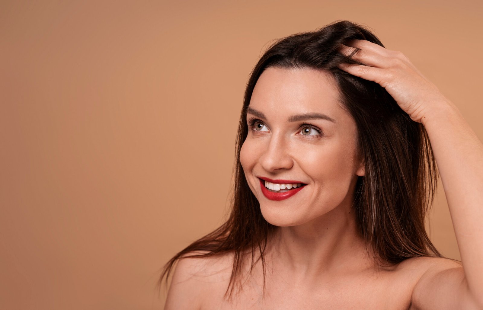 medium-shot-woman-giving-herself-scalp-massage